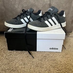 Black and white adidas shoes
